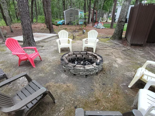 a living room with stainless steel appliances kitchen island furniture and a table