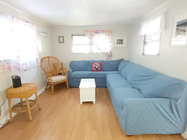a view of a patio with a table and chairs