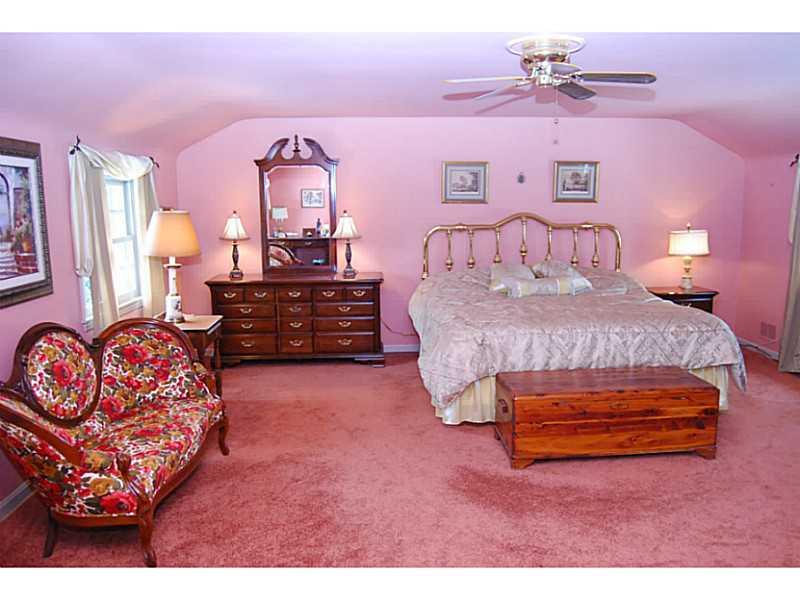 550 Miranda Road Upper St. Clair, PA 15241 - Photo 12 of 25 Master Bedroom. Master retreat reflects calming shades of the sunset....large room accommodates king furniture. Hardwood under carpet. Curved ceiling has character while maintaining wide space.