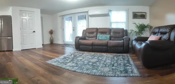 a living room with furniture and a rug