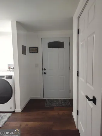 a living room with furniture and a rug