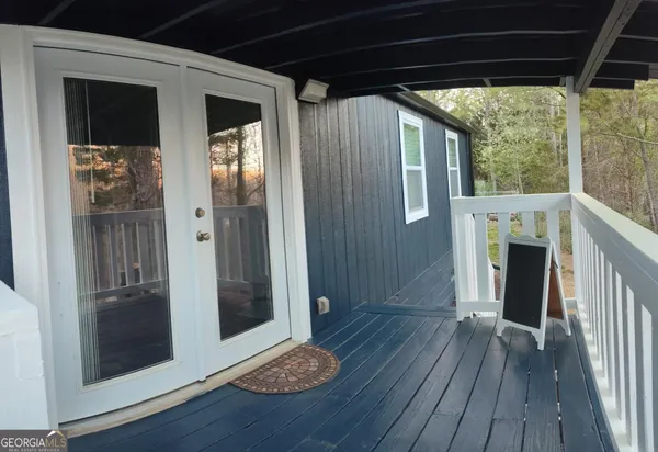 a view of entryway with wooden floor