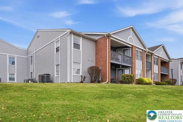 a front view of building with yard