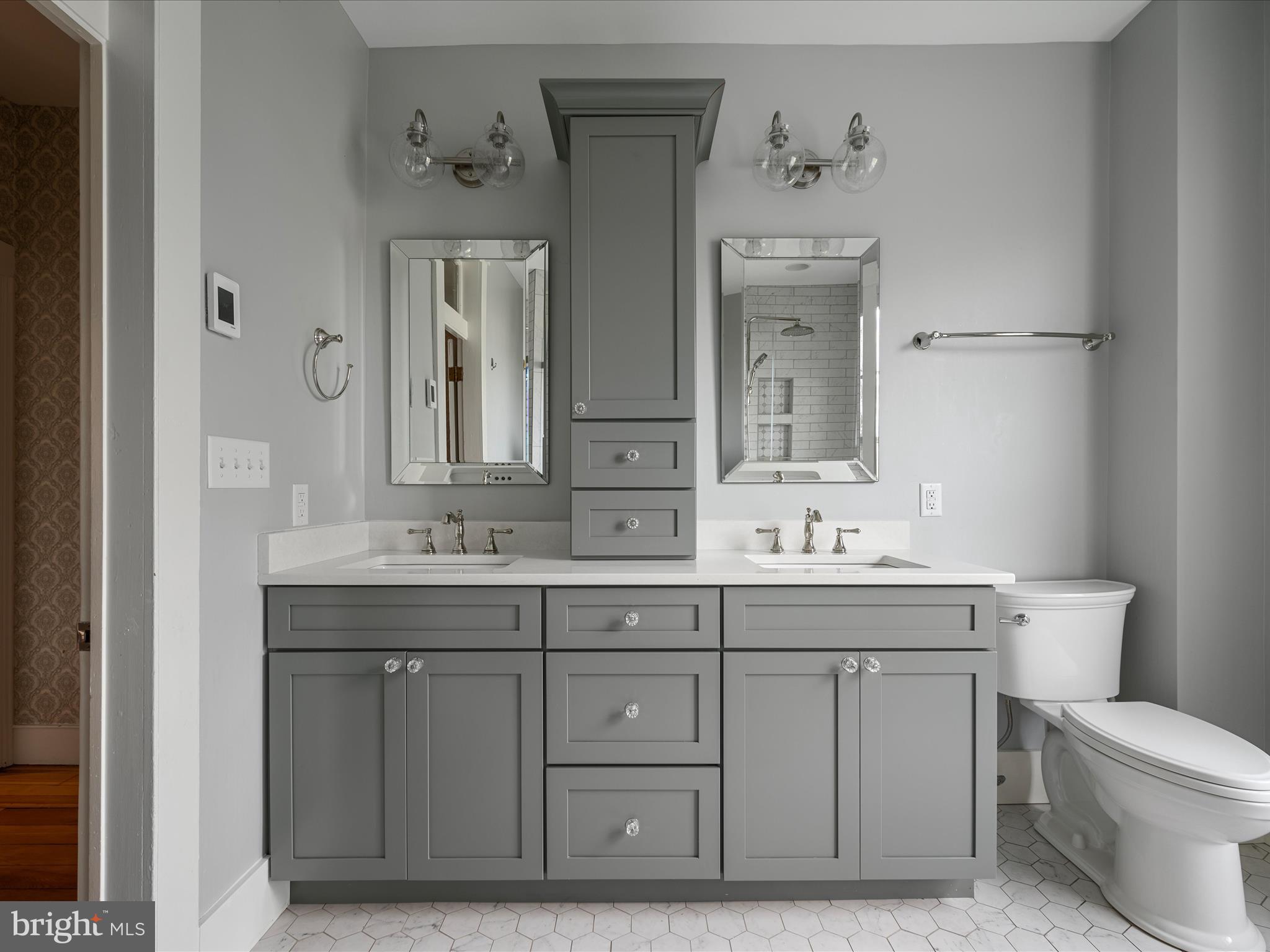 7919 Church Street Middletown, VA 22645 - Photo 23 of 48 a bathroom with a toilet a sink and mirror