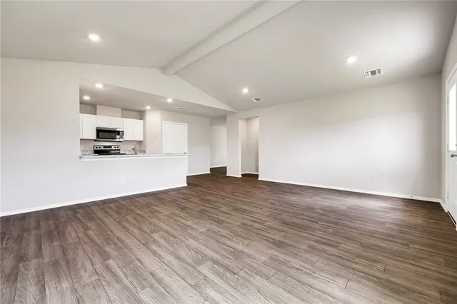 a view of a kitchen with a sink and a stove top oven
