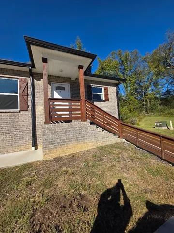 a view of a house with a snow on the wall and a roof