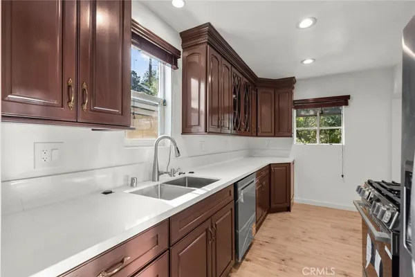 a kitchen with a sink and cabinets