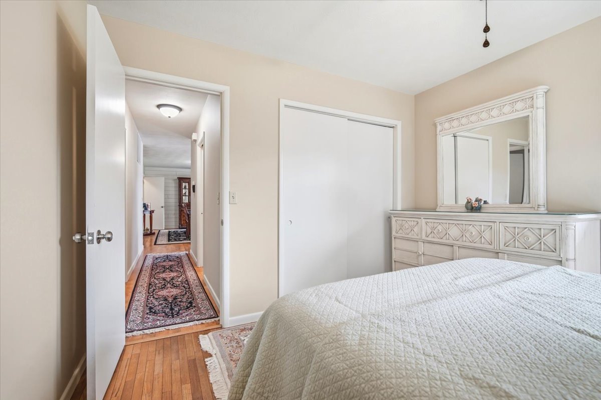 203 Highview Drive Eureka, IL 61530 - Photo 21 of 49 a bedroom with a bed and a mirror