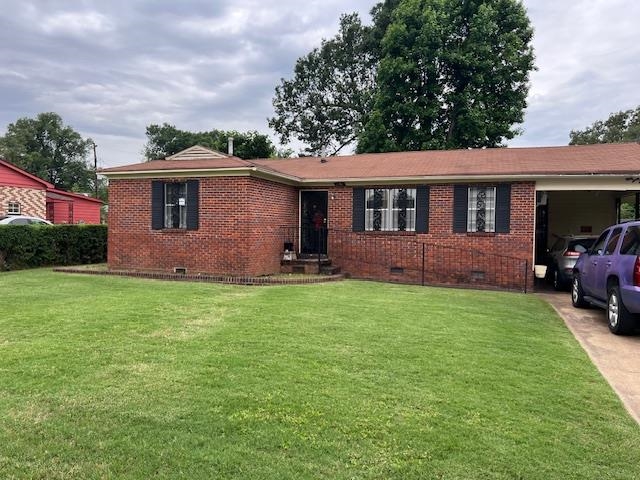 5067 Gill Road Memphis, TN 38109 - Photo 1 of 10 a view of front of a house with a yard