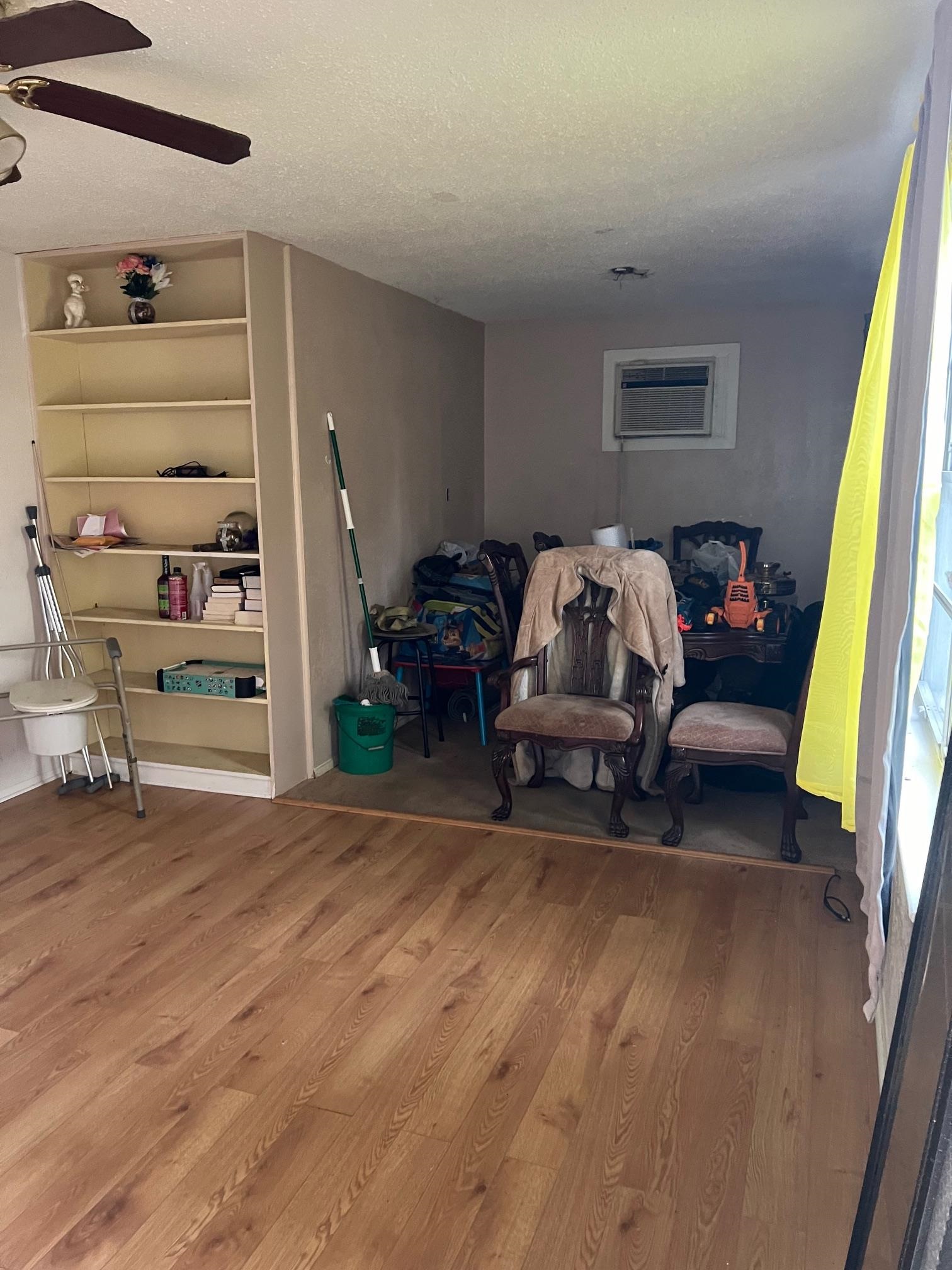 5067 Gill Road Memphis, TN 38109 - Photo 9 of 10 a living room with furniture and a wooden floor
