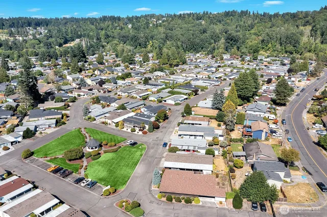 an aerial view of residential houses with outdoor space