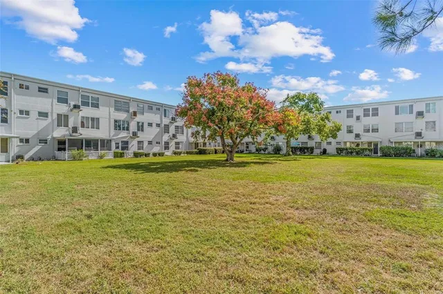 a view of a swimming pool with an outdoor space and seating area