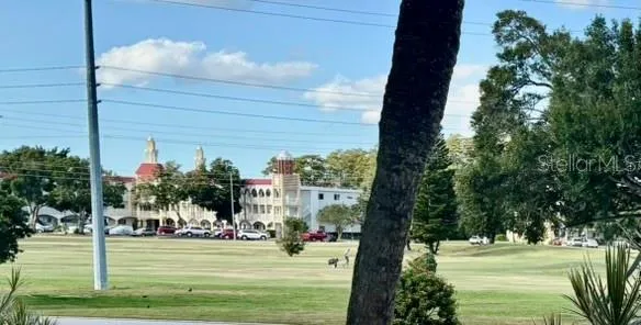 a view of a fountain in front of a house