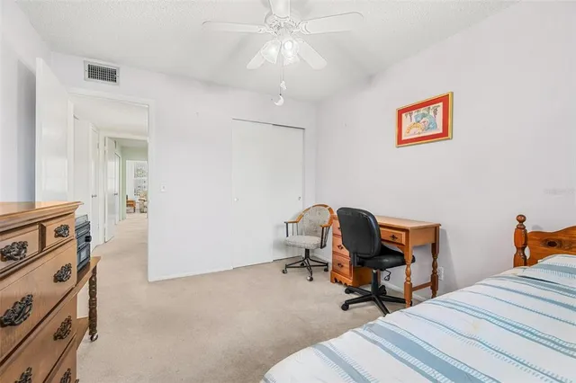 a room that has a bed and chair