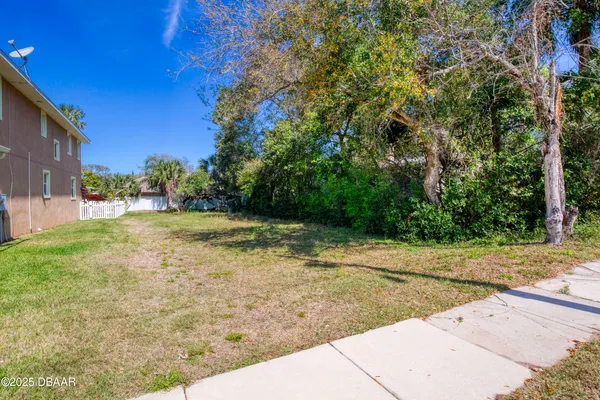 a view of a yard with an outdoor space