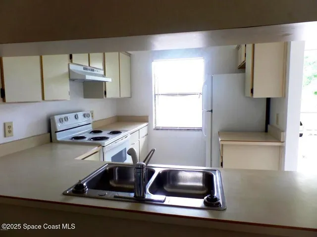 a room with furniture and a window