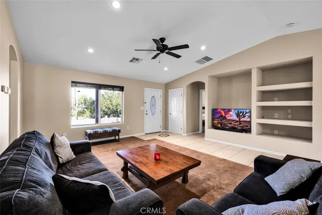 a living room with furniture and a window