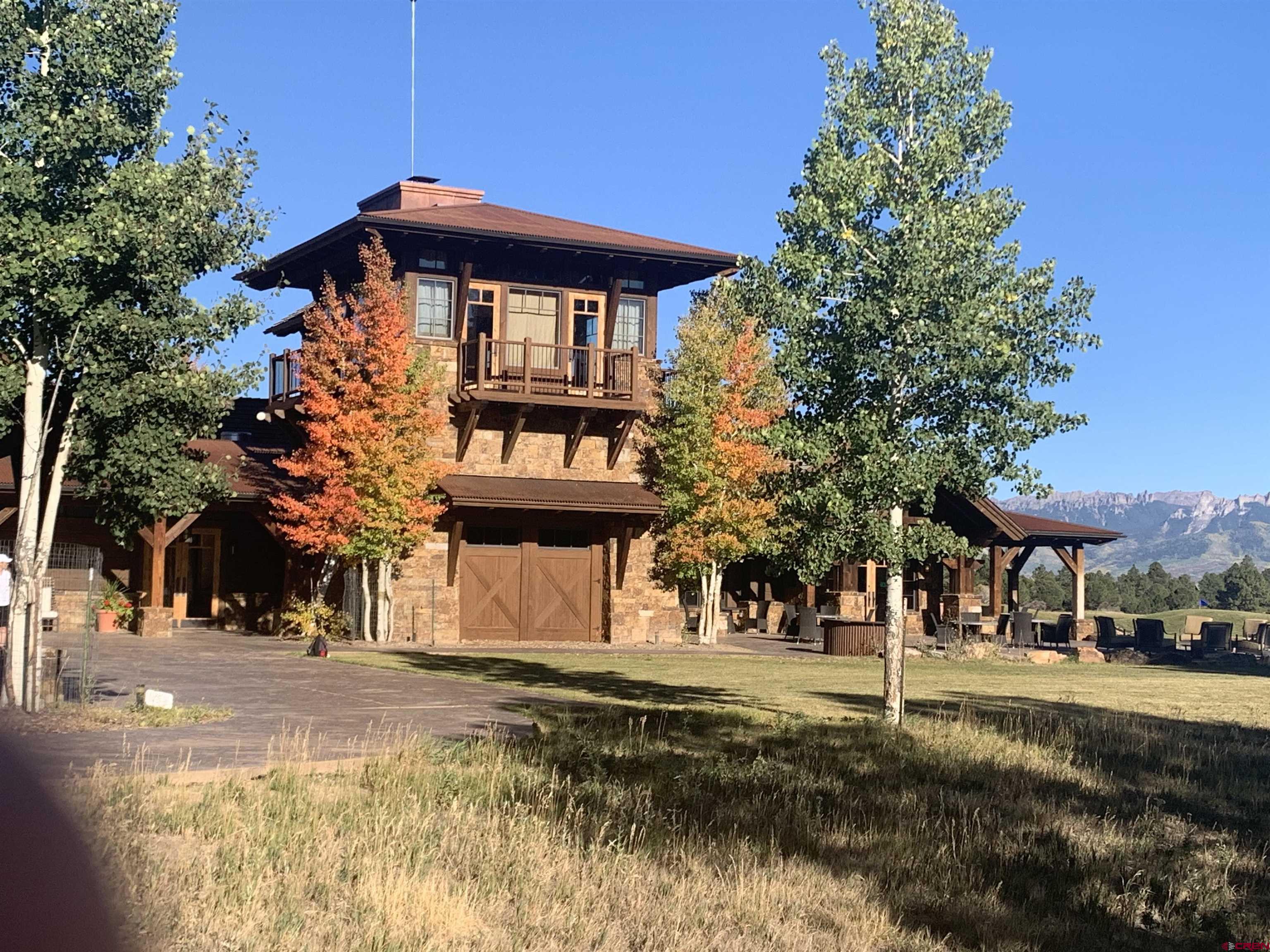 Lot 439 South Badger Trail Ridgway, CO 81432 - Photo 6 of 19 a front view of a building with trees