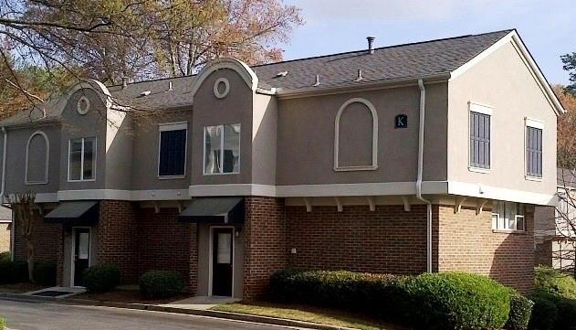 3301 Henderson Mill Road, Unit K2 Atlanta, GA 30341 - Photo 1 of 1 a front view of a house with large windows