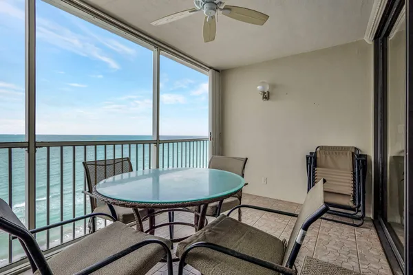 a view of a dining room with furniture window and outside view