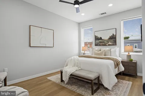 a view of a room with wooden floor