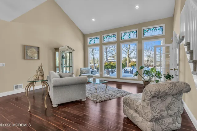 a kitchen with stainless steel appliances granite countertop a sink and wooden cabinets