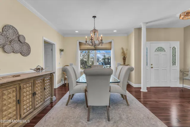 a bedroom with a bed and a dresser in it