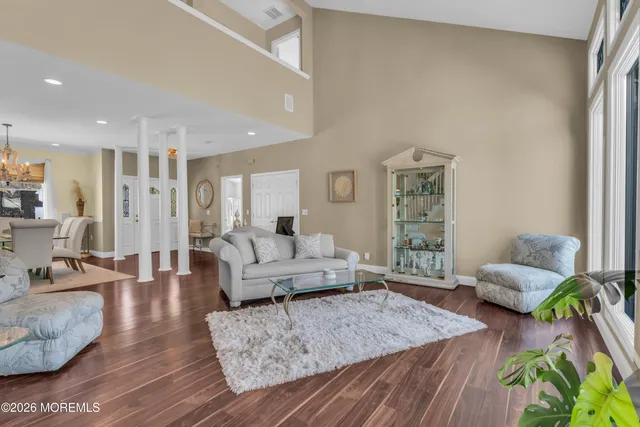 a kitchen with stainless steel appliances granite countertop a stove and white cabinets