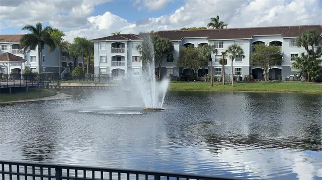 a view of a water fountain in front of a house