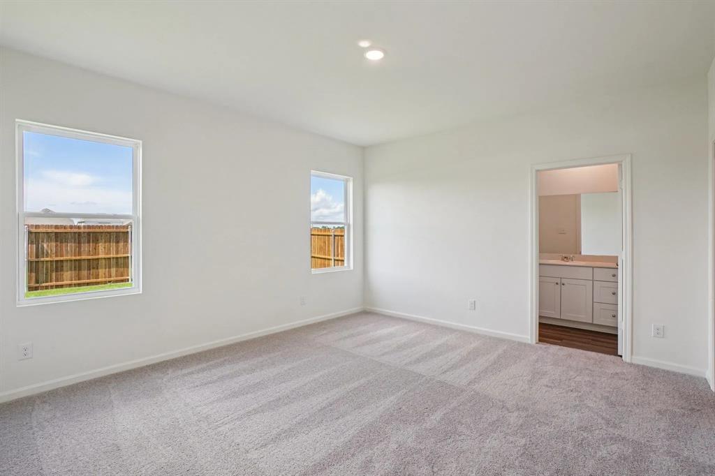 4508 Winecup Road Melissa, TX 75454 - Photo 10 of 14 Unfurnished bedroom featuring carpet floors, ensuite bathroom, and recessed lighting