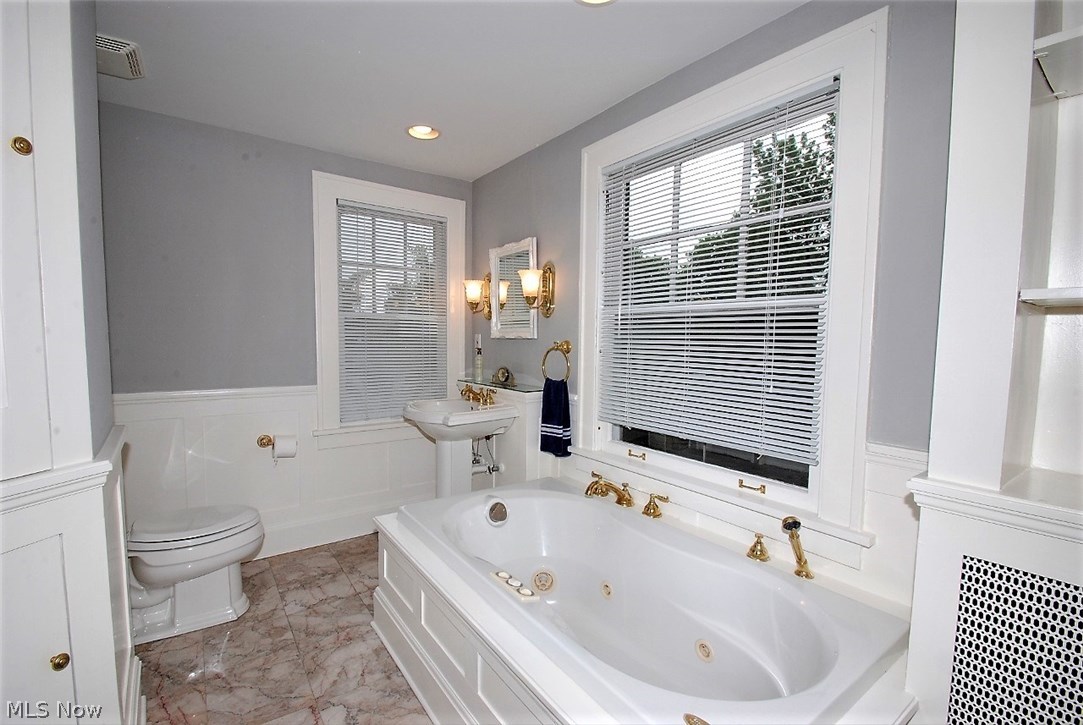 2988 Chadbourne Road Cleveland, OH 44120 - Photo 19 of 34 STUNNING UPDATED MASTER BATH WITH JUTTED TUB AND LOTS OF STORAGE!
