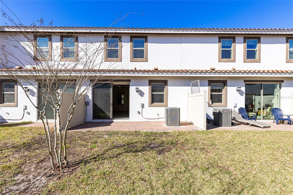 13969 Arclid Street Orlando, FL 32832 - Photo 18 of 29 a front view of a house with a porch