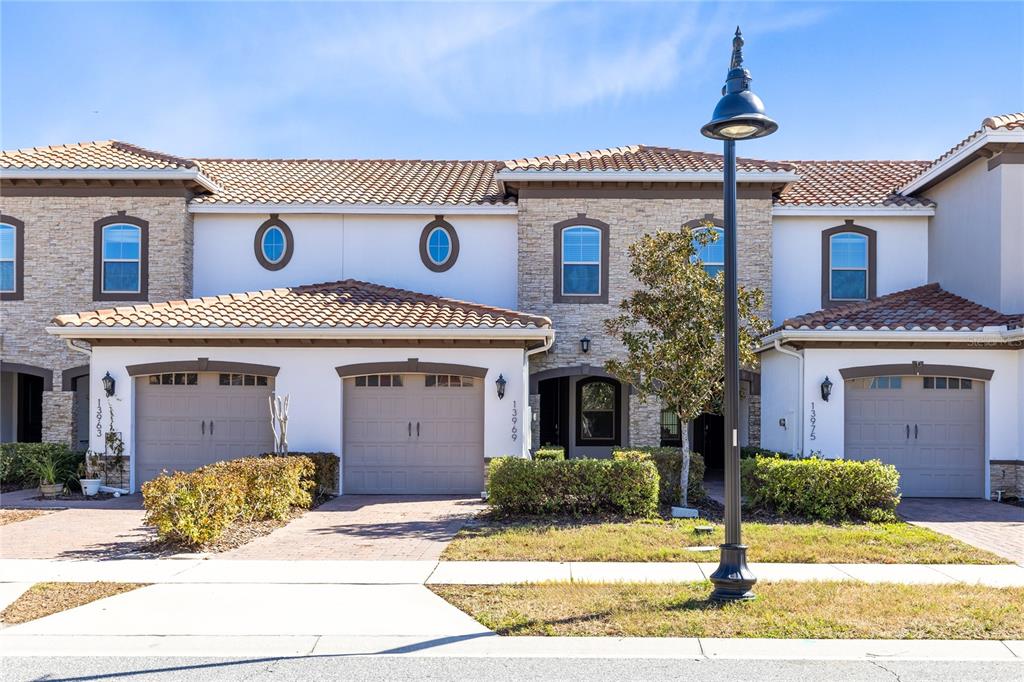 13969 Arclid Street Orlando, FL 32832 - Photo 21 of 29 a view of a house with a yard