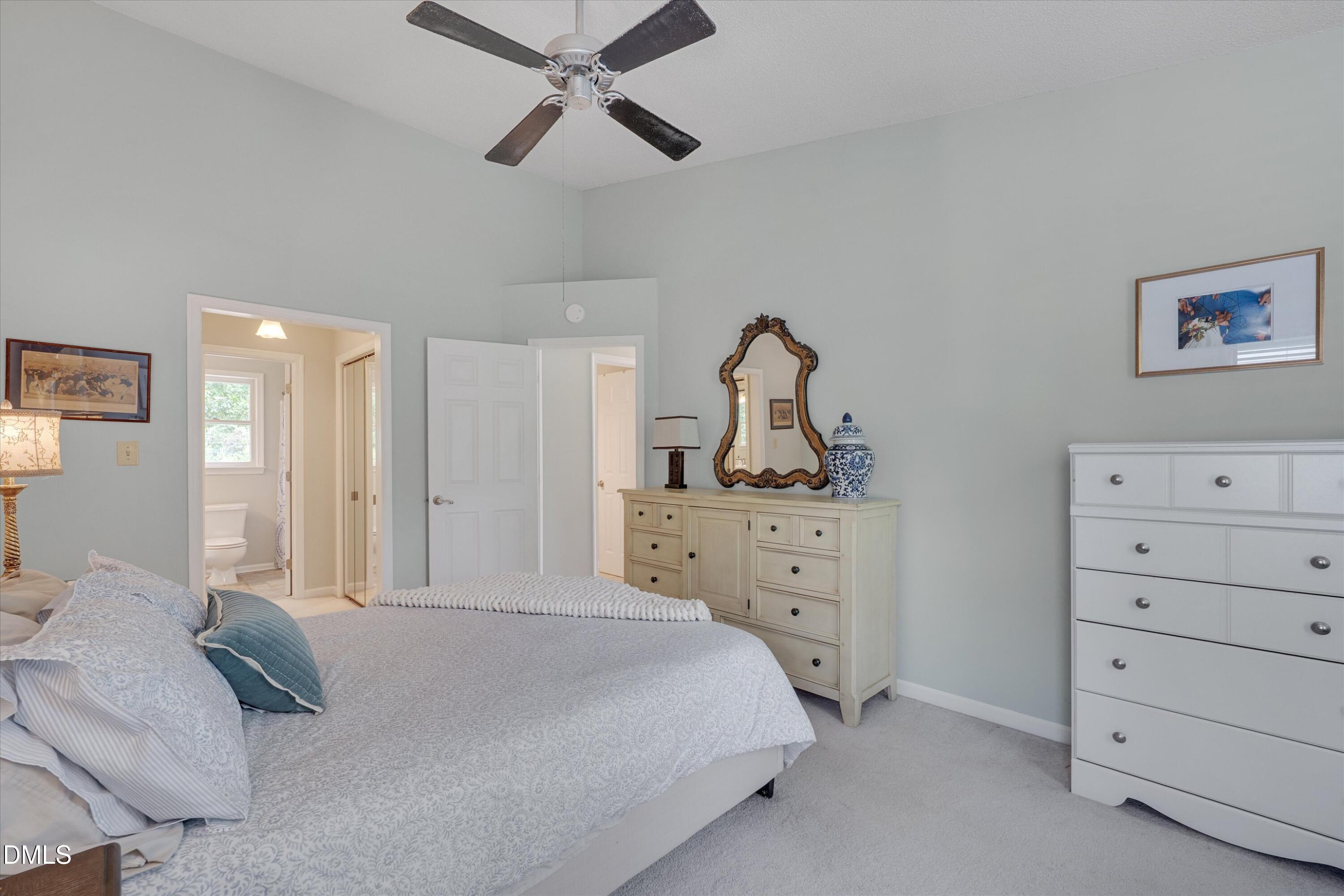 3301 Lassiter Street Durham, NC 27707 - Photo 19 of 32 a bedroom with a bed and a dresser