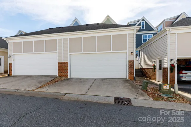 a view of a house with a parking space