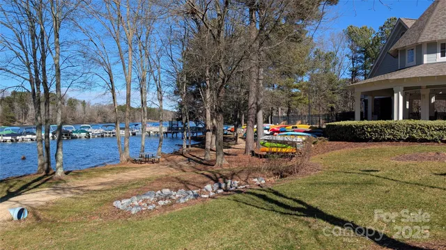 a swimming pool with outdoor seating and yard