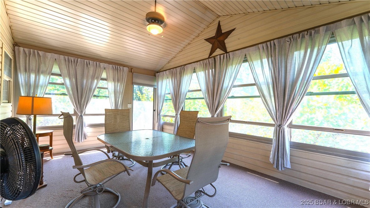 165 Lake Shadow Road Sunrise Beach, MO 65079 - Photo 13 of 50 Wonderful enclosed sun room to enjoy all year