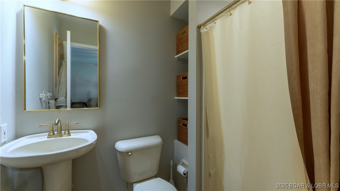 165 Lake Shadow Road Sunrise Beach, MO 65079 - Photo 22 of 50 Attached bathroom for Guest Bedroom 1