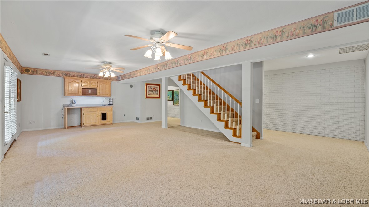 165 Lake Shadow Road Sunrise Beach, MO 65079 - Photo 24 of 50 Family room includes a wet bar with upper cabinets