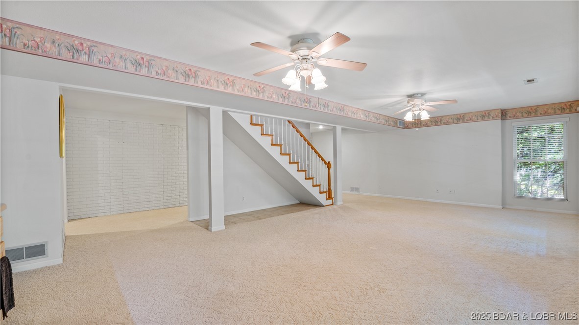 165 Lake Shadow Road Sunrise Beach, MO 65079 - Photo 25 of 50 Extra space behind stairs for kitchenette, book sh