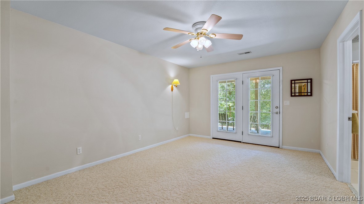 165 Lake Shadow Road Sunrise Beach, MO 65079 - Photo 26 of 50 Guest Bedroom 2 on the lower level has direct acce