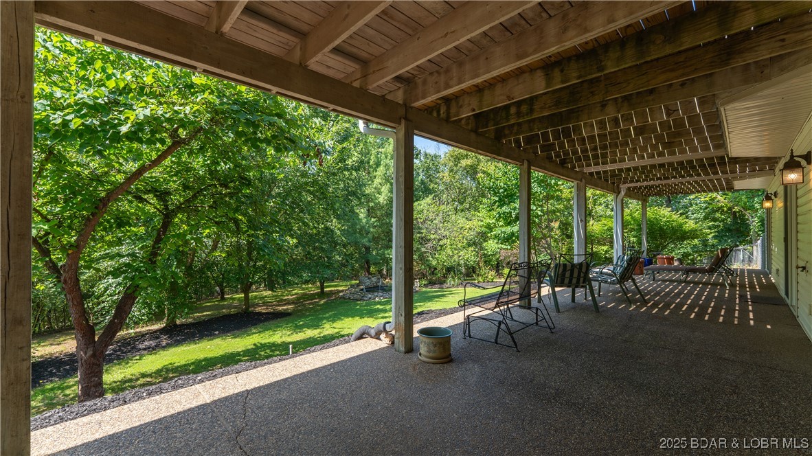 165 Lake Shadow Road Sunrise Beach, MO 65079 - Photo 36 of 50 covered patio on the lower level extends the entir