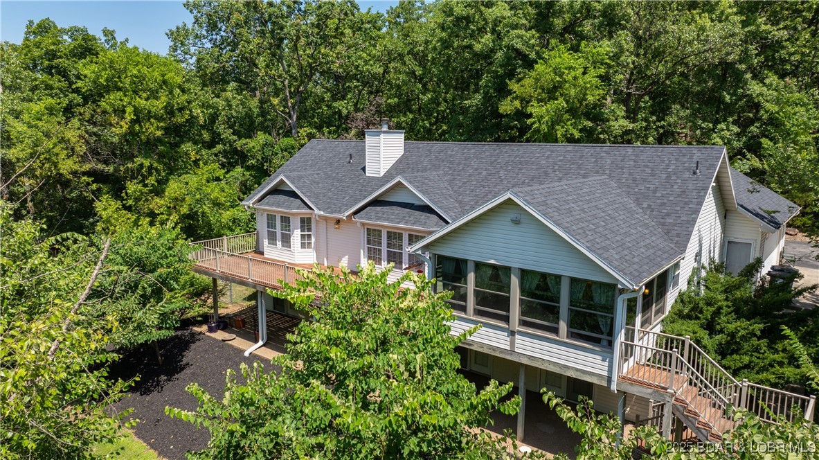 165 Lake Shadow Road Sunrise Beach, MO 65079 - Photo 41 of 50 Rear view from sun porch side of the home