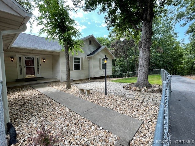 165 Lake Shadow Road Sunrise Beach, MO 65079 - Photo 46 of 50 Front yard is partially no maintenance with rock a