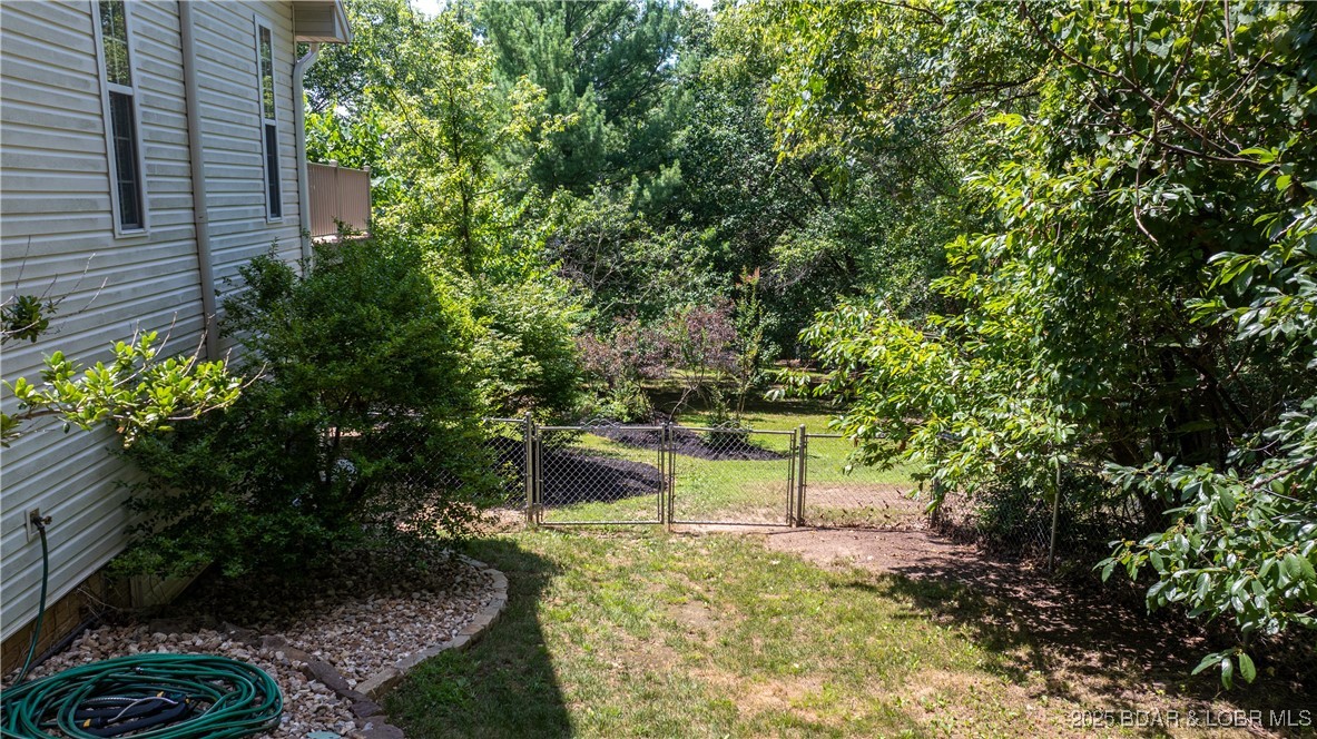165 Lake Shadow Road Sunrise Beach, MO 65079 - Photo 50 of 50 Front yard is separated from the back yard with fe