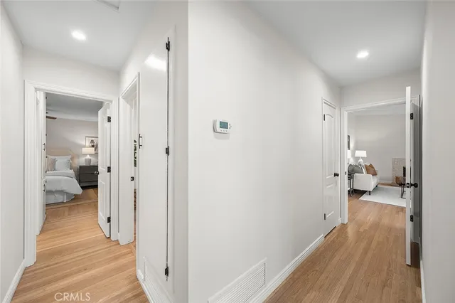 a view of a bathroom from a hallway