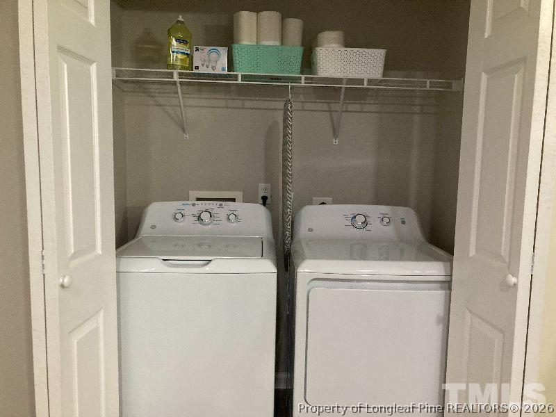 3911 Volkswalk Place Raleigh, NC 27610 - Photo 16 of 17 a utility room with dryer and washer