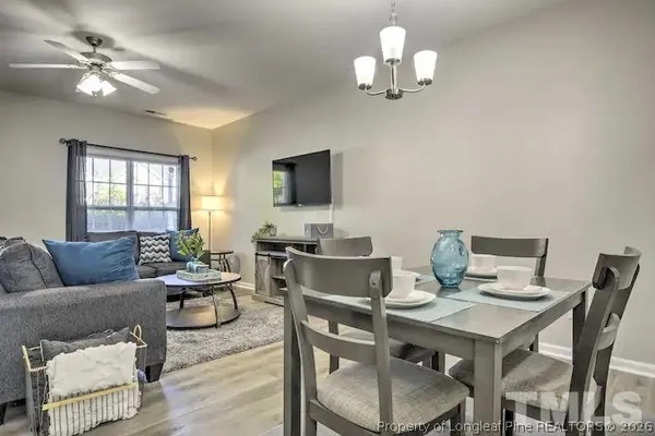 a view of a livingroom with furniture and a chandelier