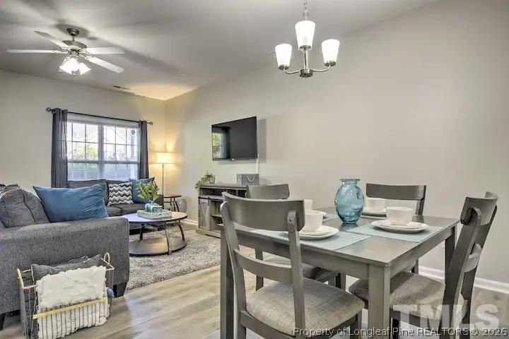3911 Volkswalk Place Raleigh, NC 27610 - Photo 5 of 17 a view of a livingroom with furniture and a chandelier