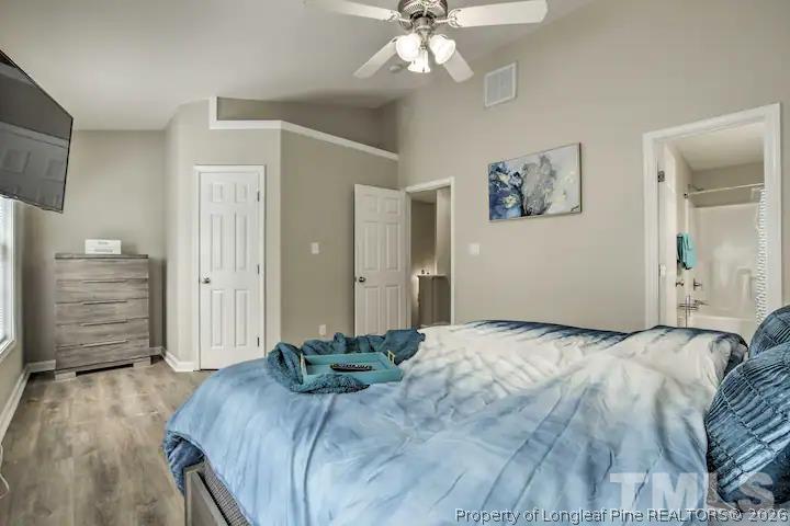 3911 Volkswalk Place Raleigh, NC 27610 - Photo 10 of 17 a bedroom with a bed and a mirror
